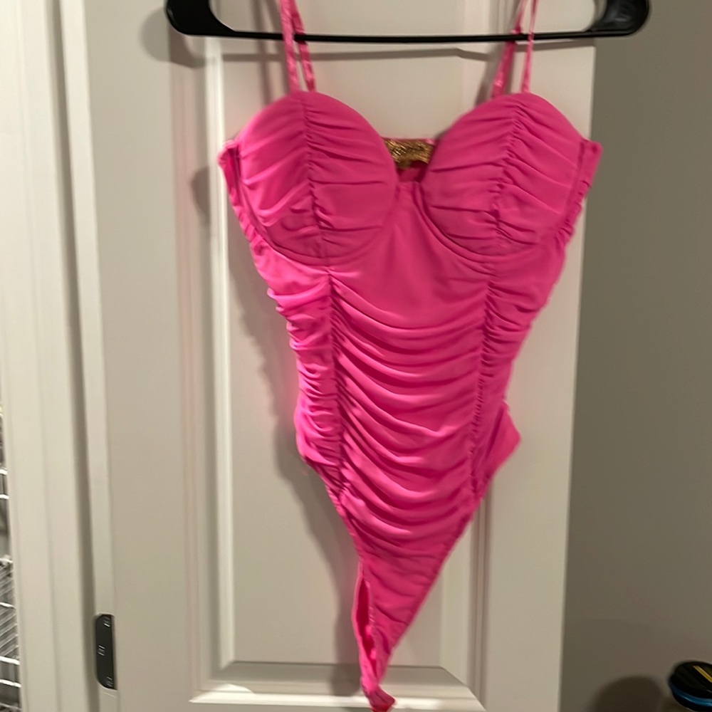 Hot pink ruched body suit with built in bra support. Worn once.